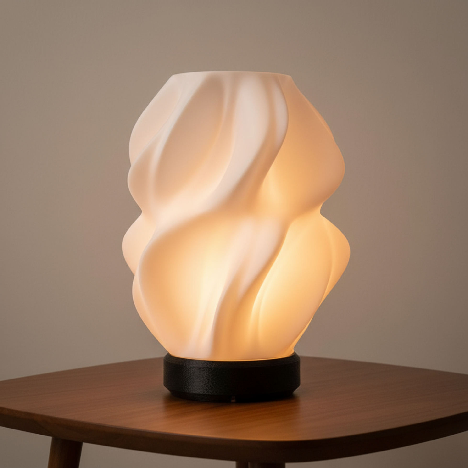Decorative table lamp with wavy design on a wooden table against a neutral background